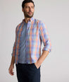 Model is wearing UNTUCKit Stratford vintage wash in plaid orange. 