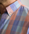 Model is wearing UNTUCKit Stratford vintage wash in plaid orange. 