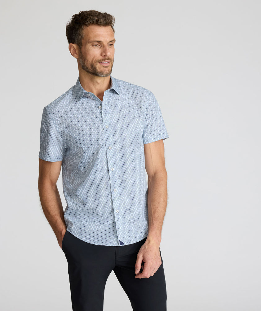 Model is wearing UNTUCKit Wrinkle-Free Short-Sleeve Strauss Shirt in Gray Diamond Print.