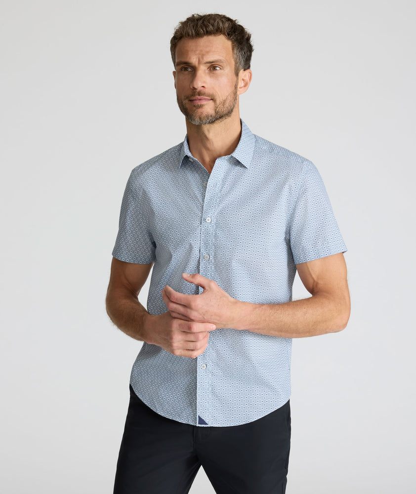 Model is wearing UNTUCKit Wrinkle-Free Short-Sleeve Strauss Shirt in Gray Diamond Print.