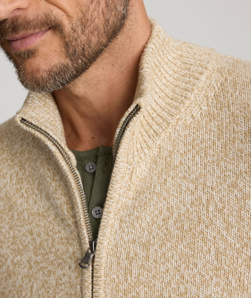 Model is wearing  UNTUCKit Sturgeon Twisted Full Zip Cardigan in Oatmeal.