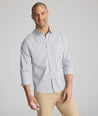 Model is wearing UNTUCKit CottonTek Brachetto Shirt in Blue and Brown Check. 