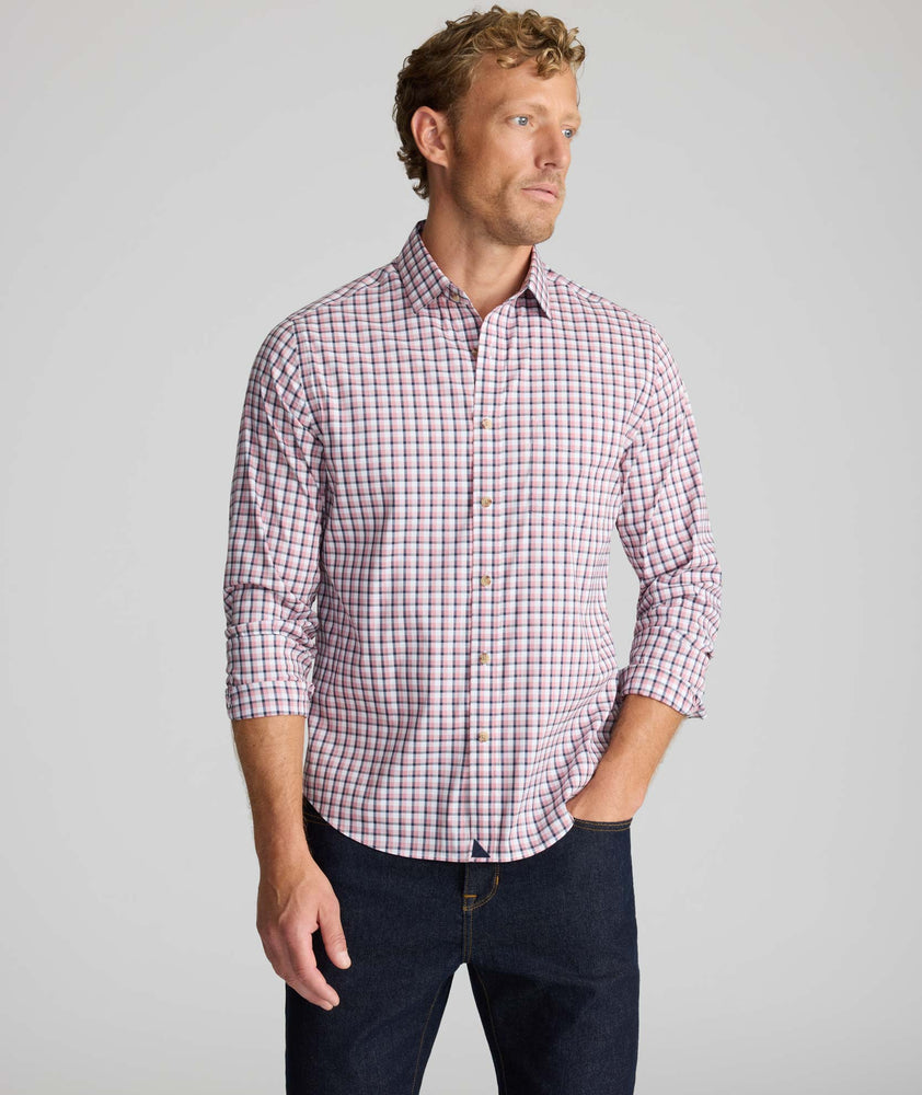 Model is wearing UNTUCKit CottonTek Brachetto Shirt in Burgundy Check. 