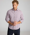 Model is wearing UNTUCKit CottonTek Brachetto Shirt in Burgundy Check. 