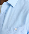 Model is wearing UNTUCKit Sutherland summer weight shirt in blue. 