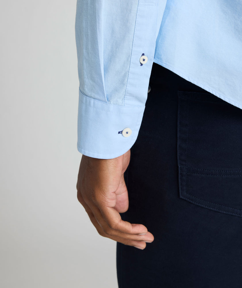 Model is wearing UNTUCKit Sutherland summer weight shirt in blue. 