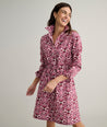 Model is wearing UNTUCKit Taylor dress in pink print.