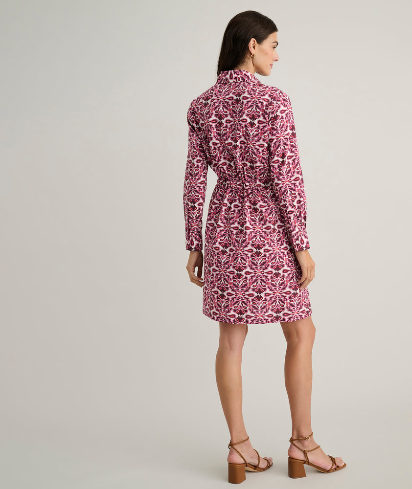 Model is wearing UNTUCKit Taylor dress in pink print.