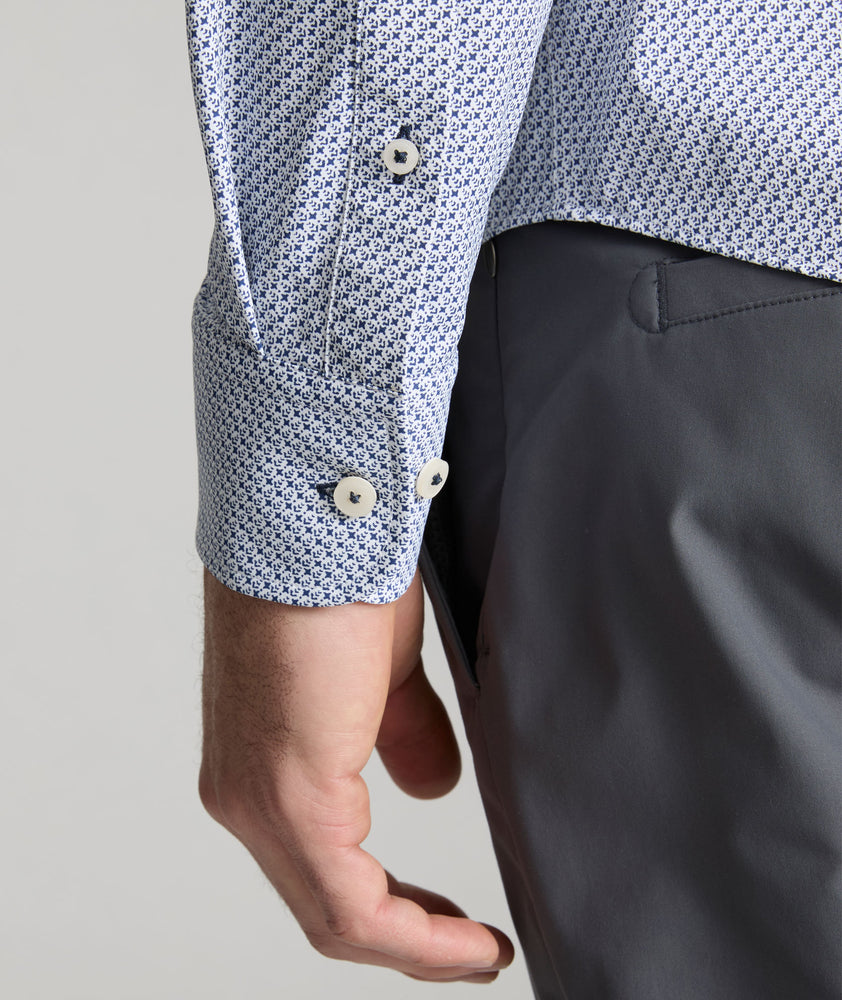 Model is wearing UNTUCKit Wrinkle-Free Performance Teramo Shirt in White & Navy Print.