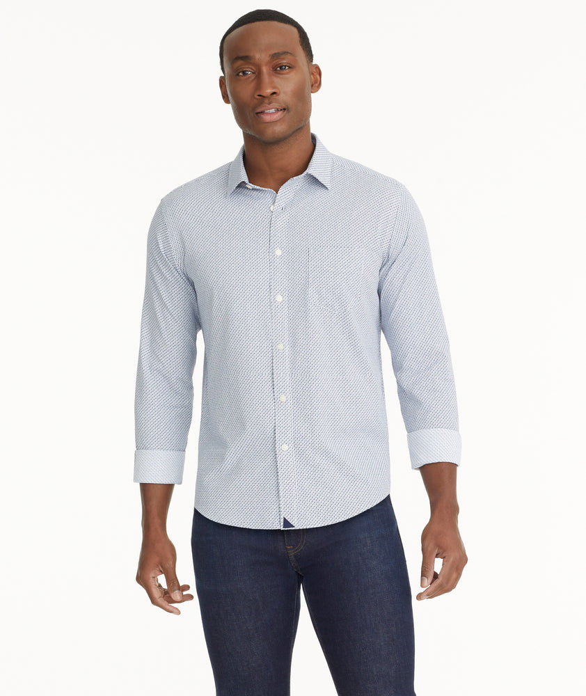 Model is wearing UNTUCKit Wrinkle-Free Performance Teramo Shirt in White & Navy Print.