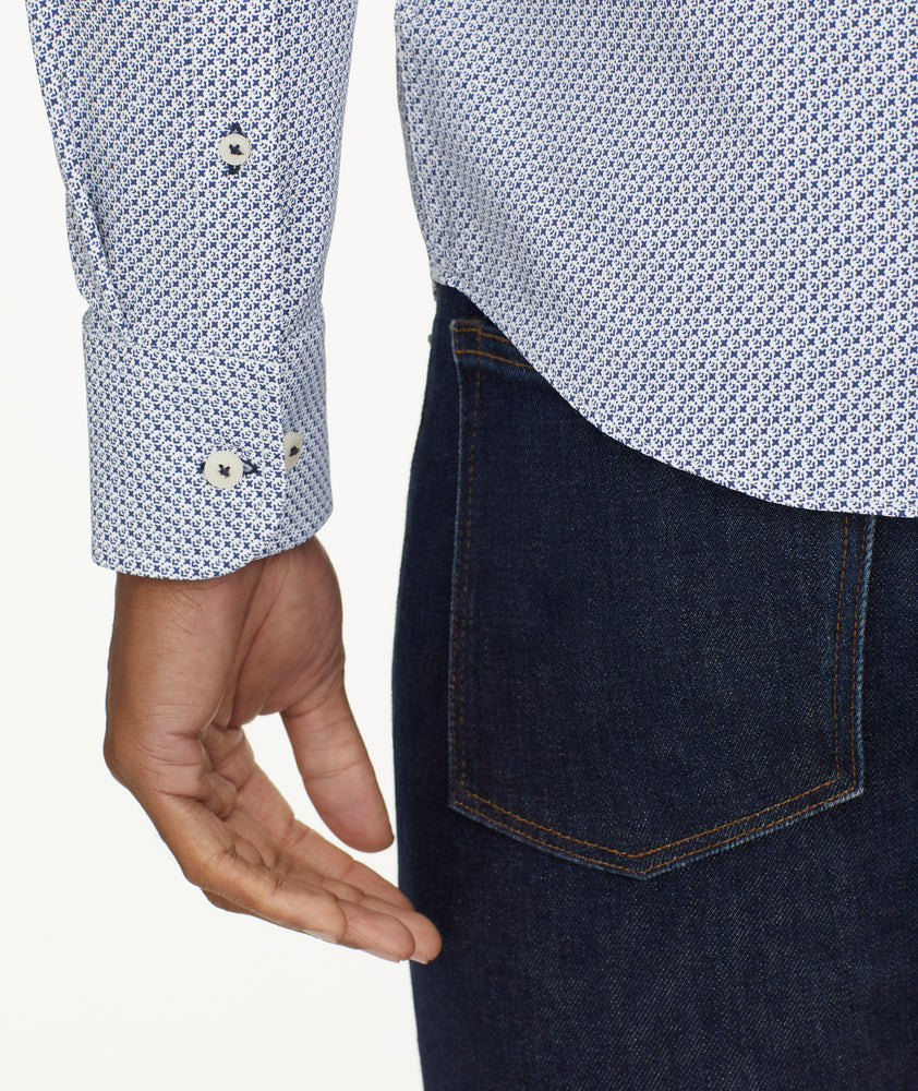 Model is wearing UNTUCKit Wrinkle-Free Performance Teramo Shirt in White & Navy Print.