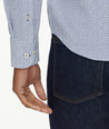 Model is wearing UNTUCKit Wrinkle-Free Performance Teramo Shirt in White & Navy Print.