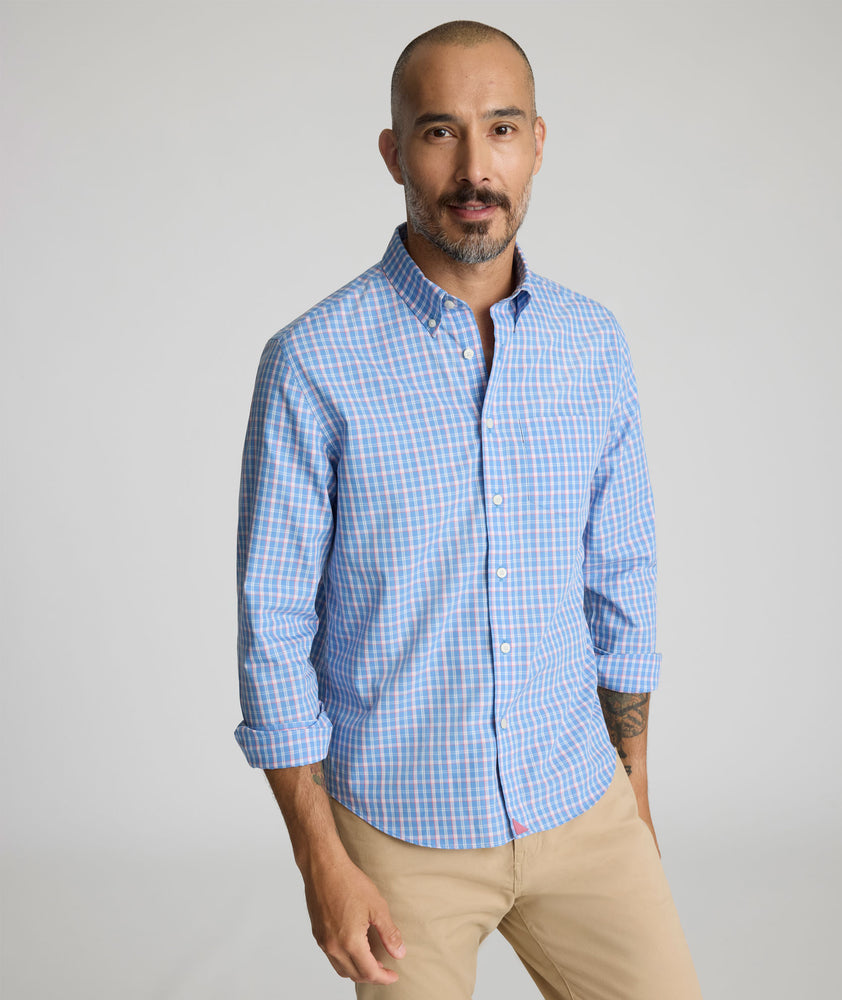 Model is wearing UNTUCKit Wrinkle-Free Thorne Shirt in blue.
