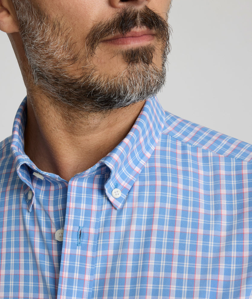Model is wearing UNTUCKit Wrinkle-Free Thorne Shirt in blue.