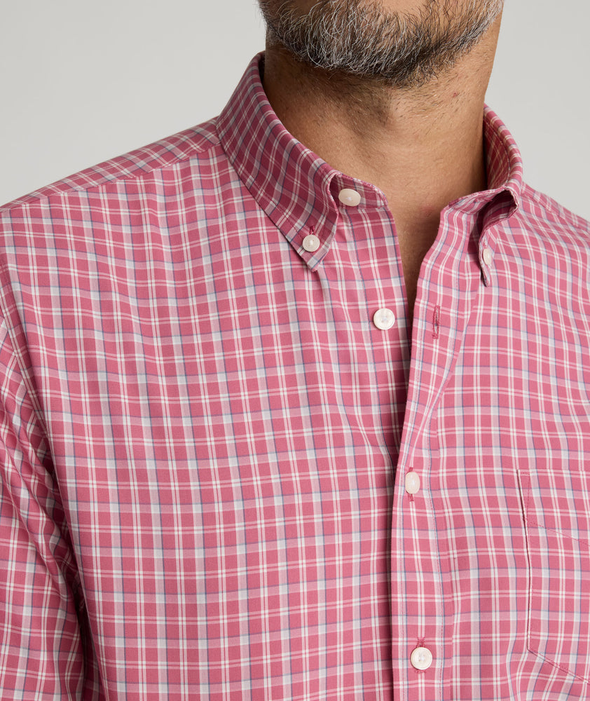 Model is wearing UNTUCKit Wrinkle-Free Thorne Shirt in red.