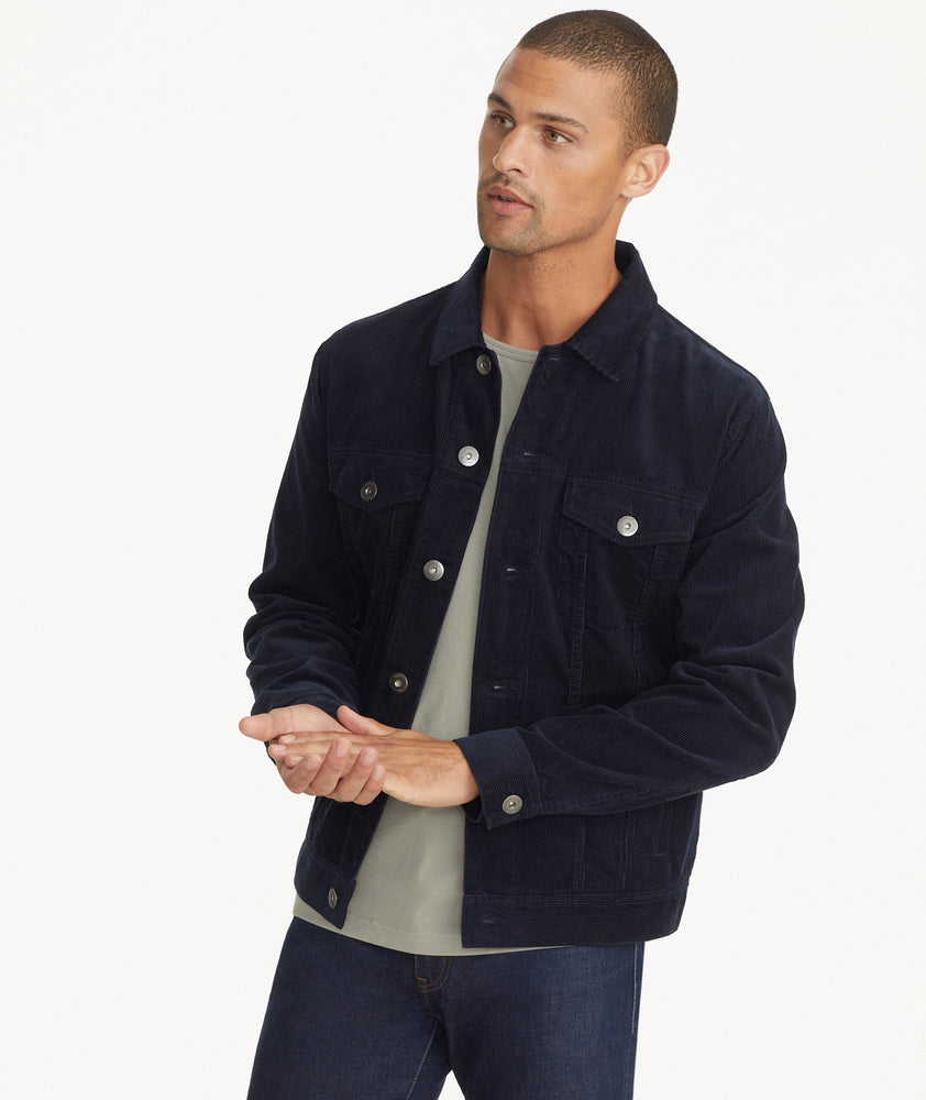 Model is wearing UNTUCKit Corduroy Reid Jacket in Navy.