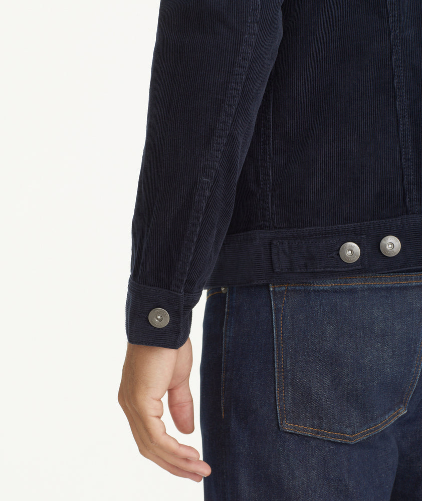 Model is wearing UNTUCKit Corduroy Reid Jacket in Navy.