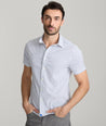 Model is wearing UNTUCKit Tidwell performance shirt. 