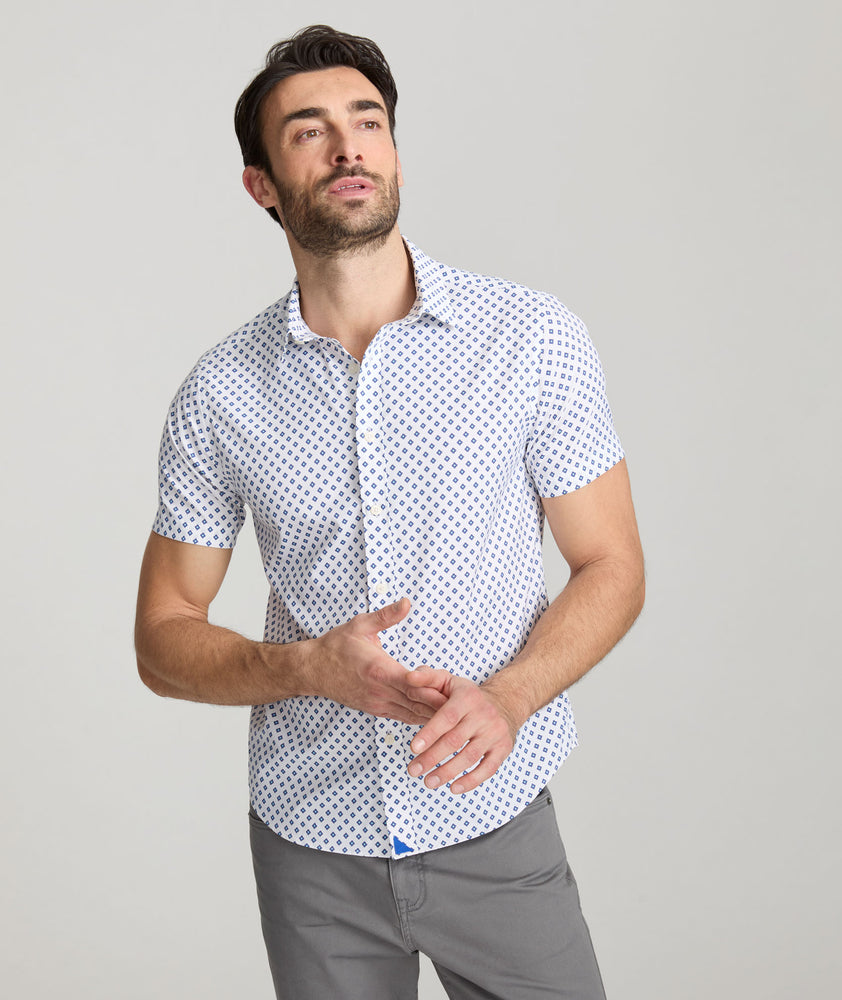 Model is wearing UNTUCKit Tidwell performance shirt. 