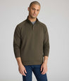 Model is wearing UNTUCKit Toovey Performance Quarter Zip  in Sea Turtle.