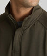 Model is wearing UNTUCKit Toovey Performance Quarter Zip  in Sea Turtle.