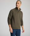 Model is wearing UNTUCKit Toovey Performance Quarter Zip  in Sea Turtle.