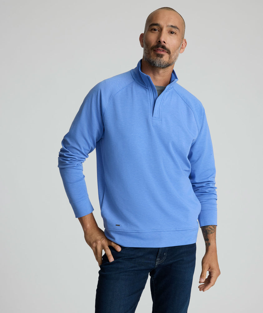 Model is wearing UNTUCKit Toovy Performance Quarter Zip in Blue yonder.