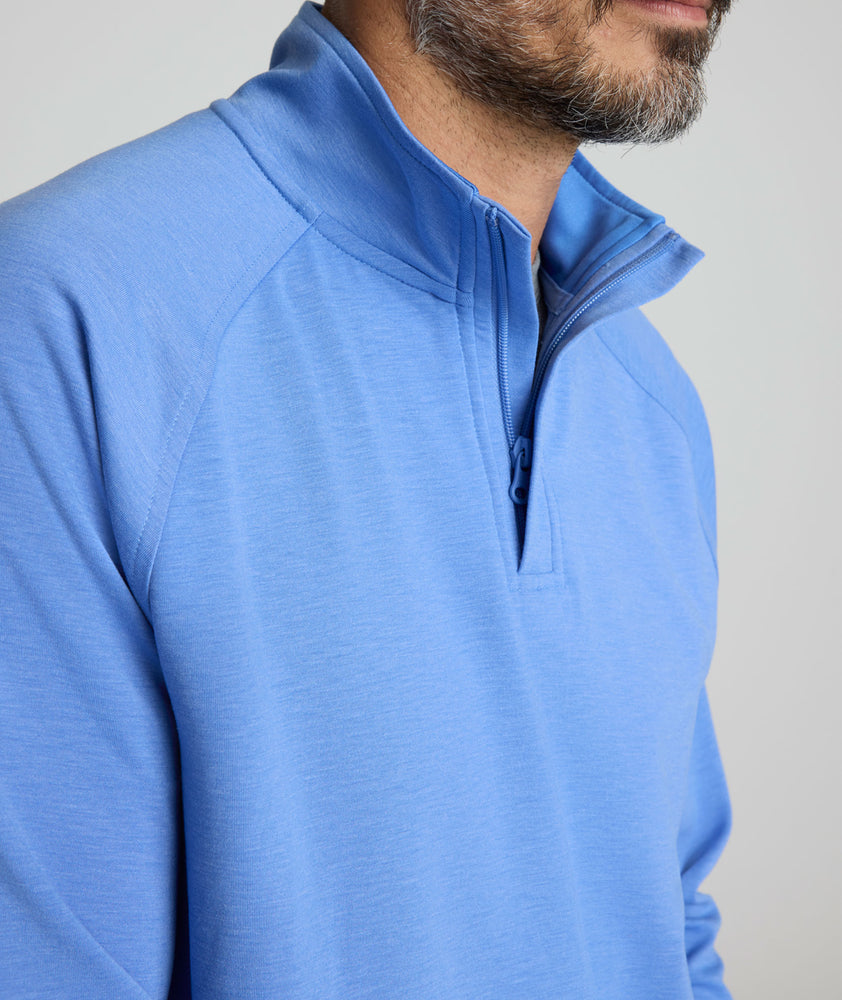 Model is wearing UNTUCKit Toovy Performance Quarter Zip in Blue yonder.