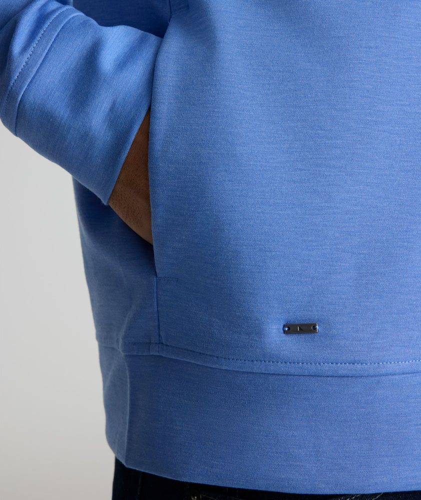 Model is wearing UNTUCKit Toovy Performance Quarter Zip in Blue yonder.