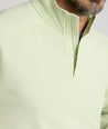 Model is wearing UNTUCKit Toovy Performance Quarter Zip in Fog Green.