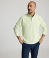 Model is wearing UNTUCKit Toovy Performance Quarter Zip in Fog Green.