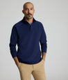 Model is wearing UNTUCKit Toovy Performance Quarter Zip in Evening Blue