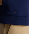 Model is wearing UNTUCKit Toovy Performance Quarter Zip in Evening Blue
