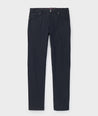 Model is wearing UNTUCKit Torre 5-Pocket Tech Pant in Black. 