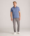 Model is wearing UNTUCKit 5-Pocket Performance Tech Pants in Gray.