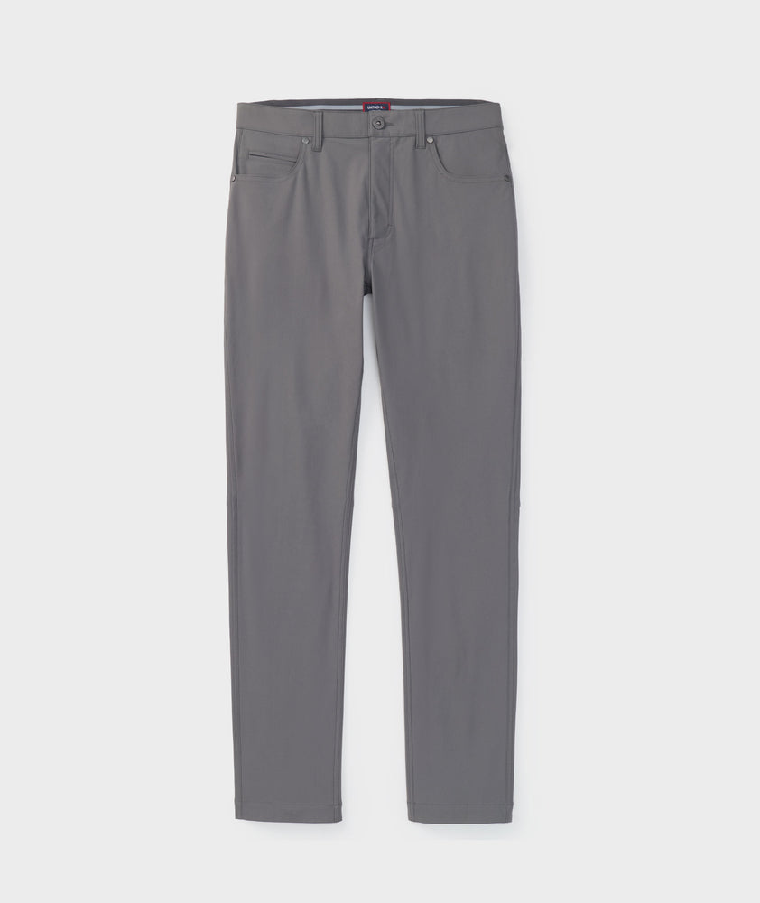 Model is wearing UNTUCKit 5-Pocket Performance Tech Pants in Gray.