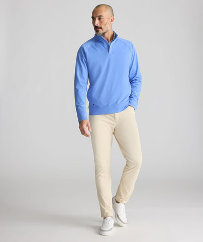 Model is wearing UNTUCKit 5-Pocket Performance Tech Pants in Tan.