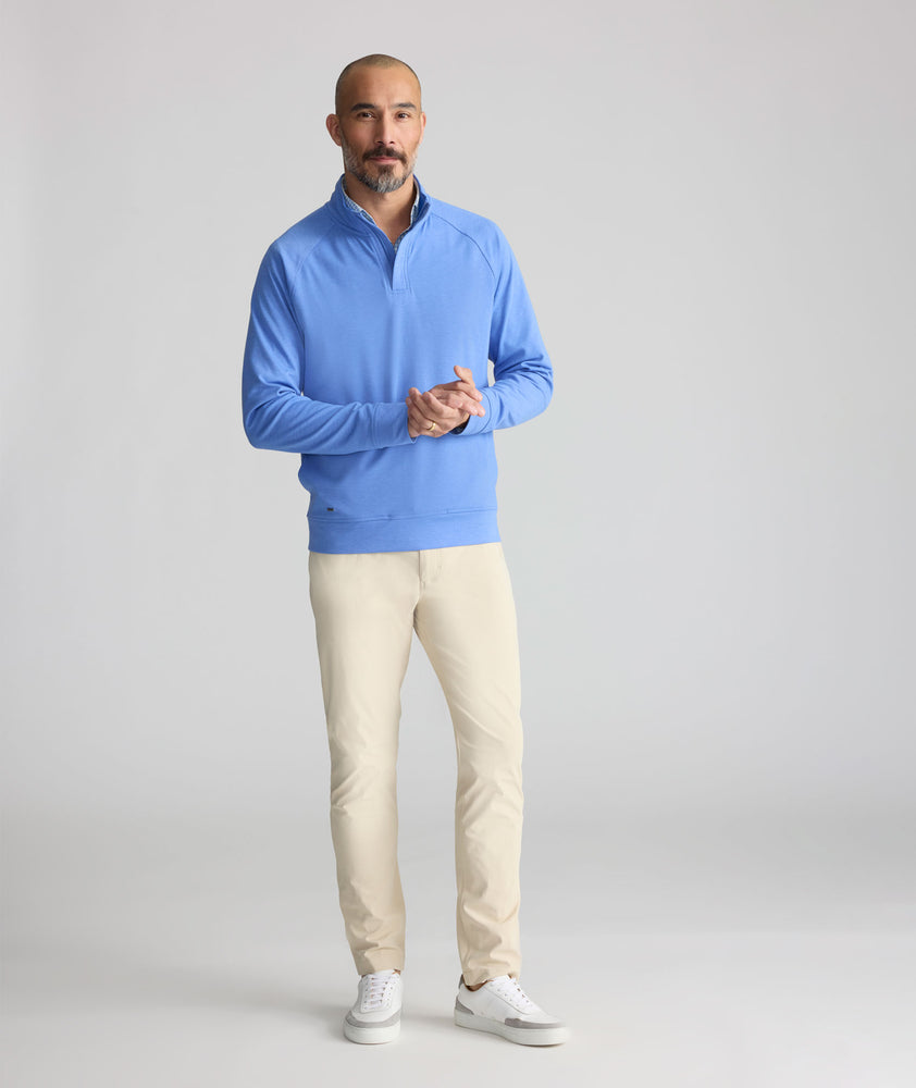 Model is wearing UNTUCKit 5-Pocket Performance Tech Pants in Tan.