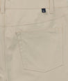 Model is wearing UNTUCKit 5-Pocket Performance Tech Pants in Tan.