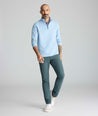 Model is wearing UNTUCKit traveler tech pants. 