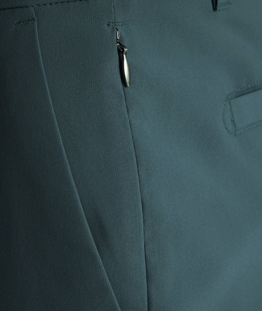 Model is wearing UNTUCKit traveler tech pants. 