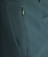 Model is wearing UNTUCKit traveler tech pants. 