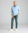 Model is wearing UNTUCKit traveler tech pants. 