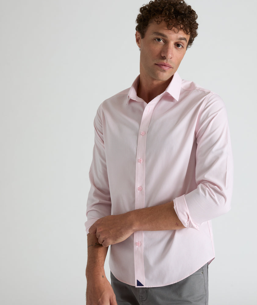Model is wearing Travers shirt in pink. 