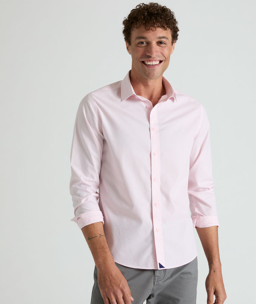 Model is wearing Travers shirt in pink. 