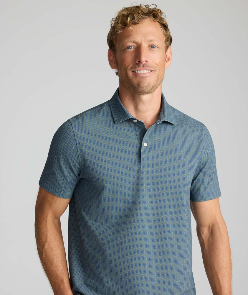 Model is wearing UNTUCKit Printed CottonTek™ Polo Blue Print. 