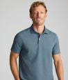 Model is wearing UNTUCKit Printed CottonTek™ Polo Blue Print. 