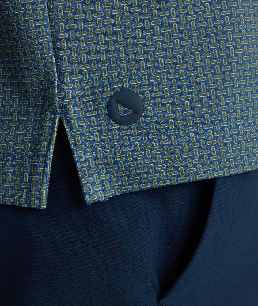 Model is wearing UNTUCKit Printed CottonTek™ Polo Blue Print. 