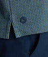 Model is wearing UNTUCKit Printed CottonTek™ Polo Blue Print. 