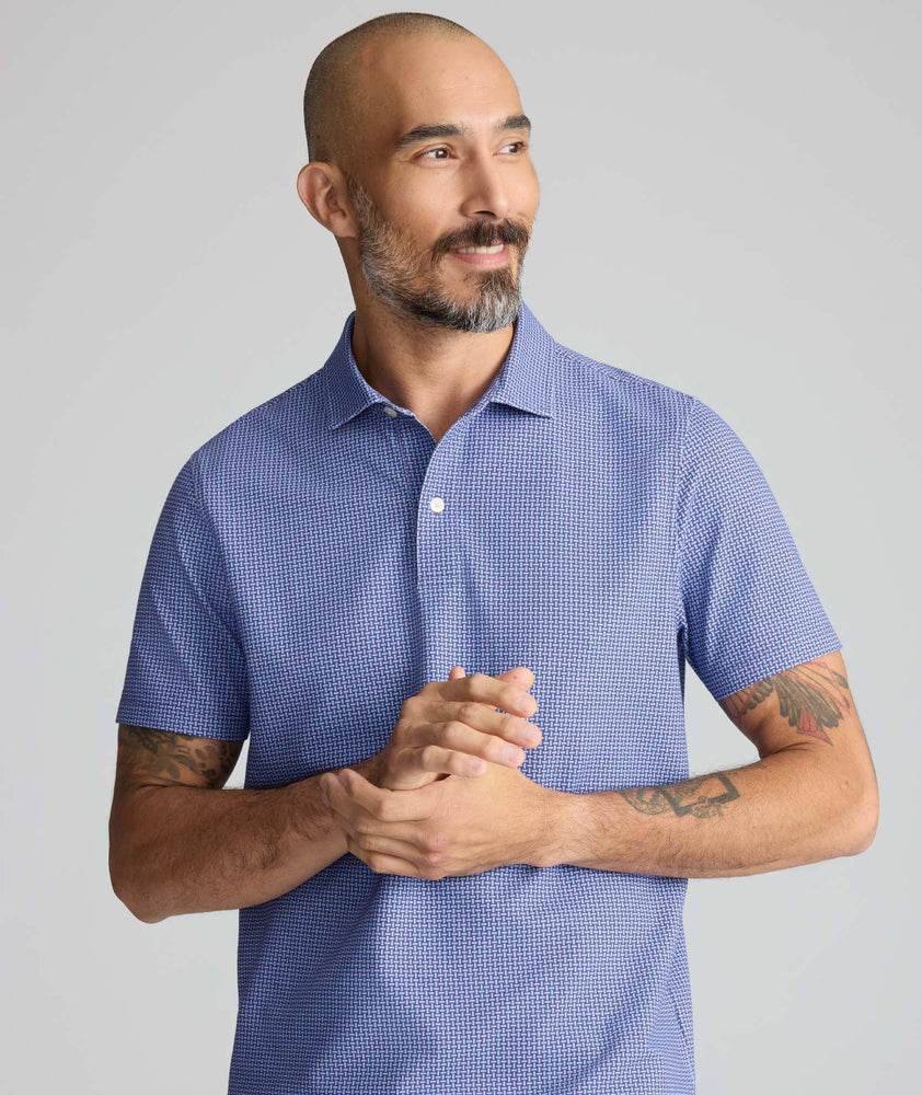 Model is wearing UNTUCKit Printed CottonTek™ Polo Blue Print. 